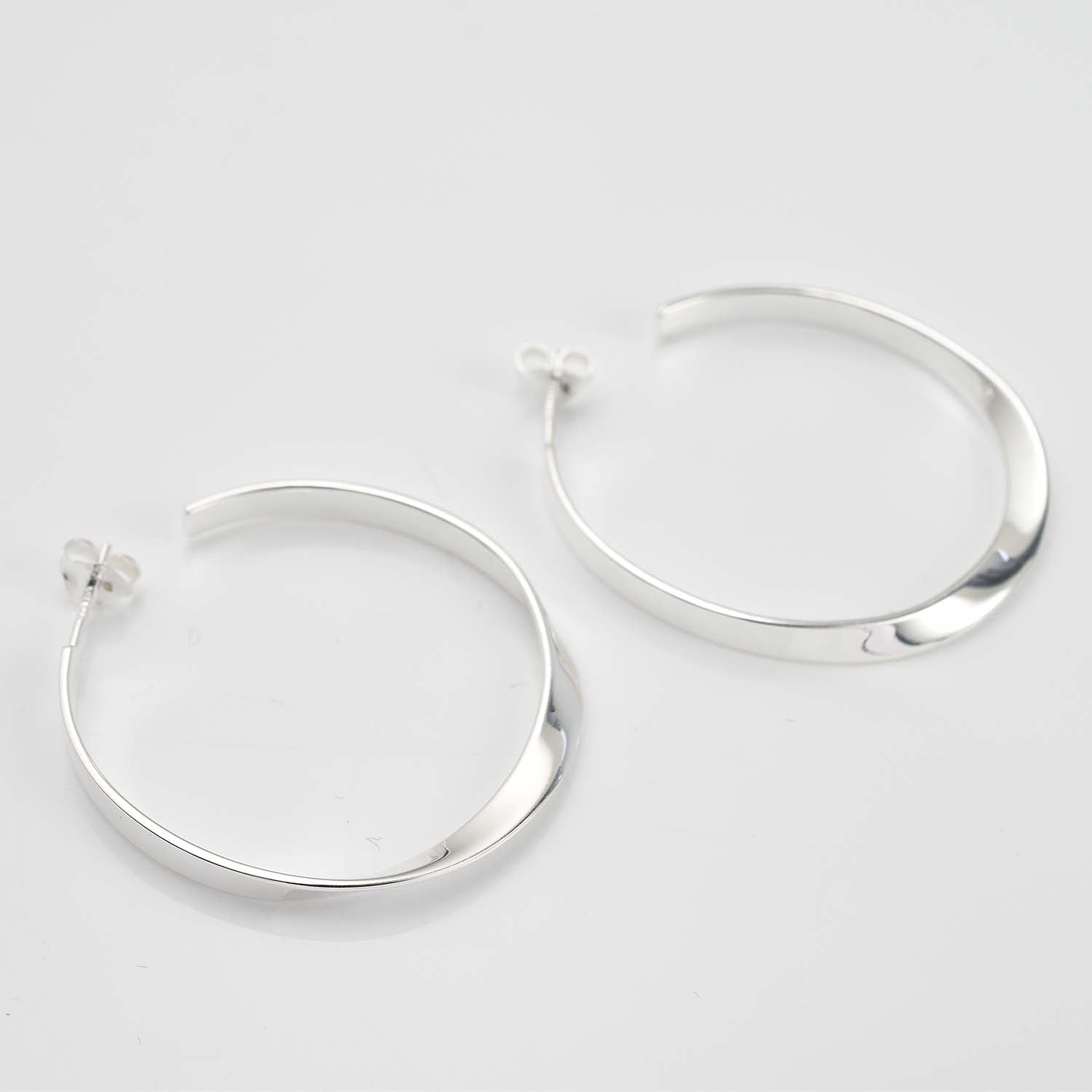 Sleek Horizon Twist Hoops