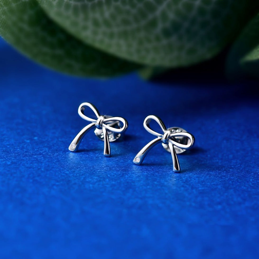 Moon-Seed Festive Bow Earrings in White & Gold on Marmalade | The  Internet's Best Brands